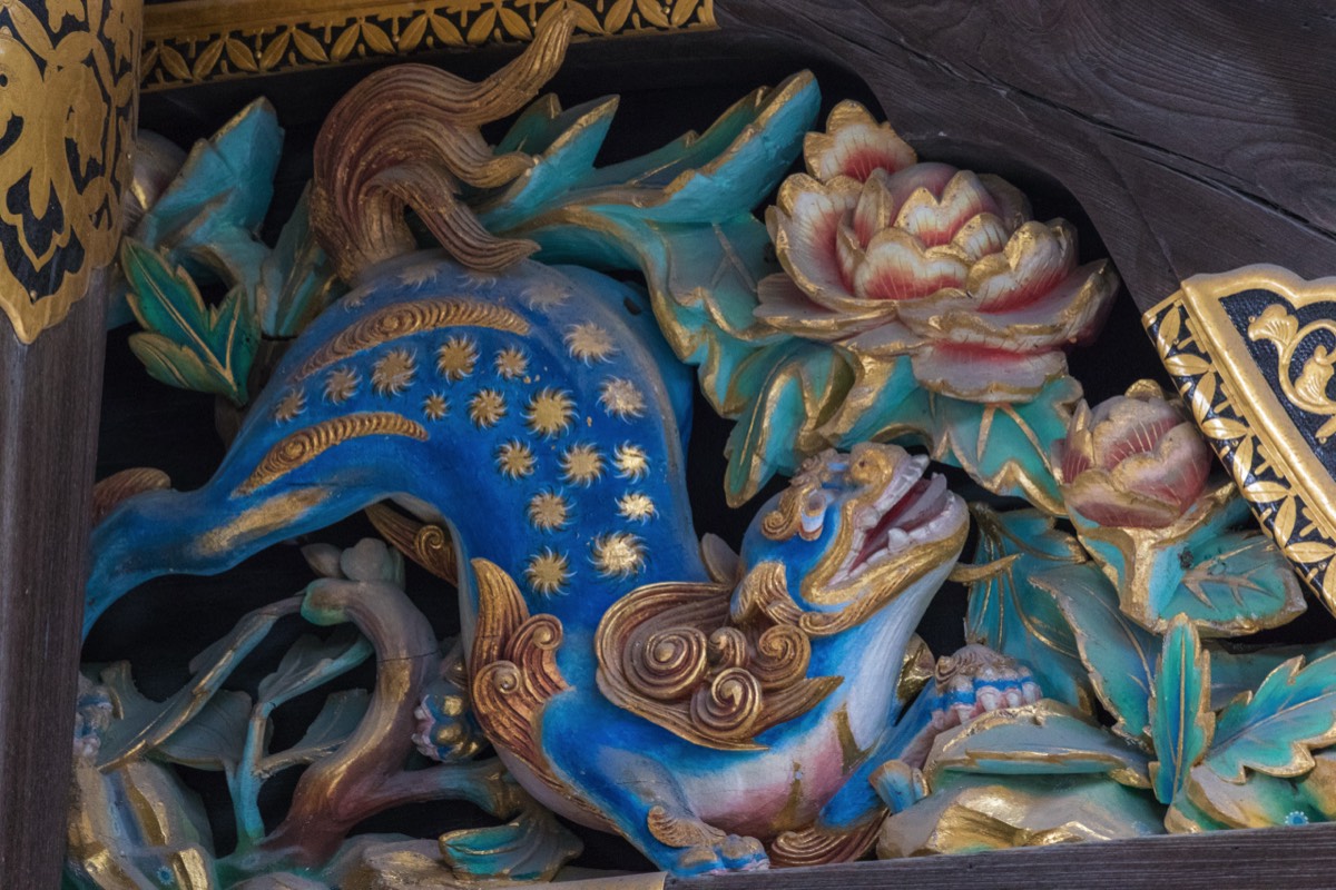 Detailed ornament; dog, cat, lion, mythical beast?